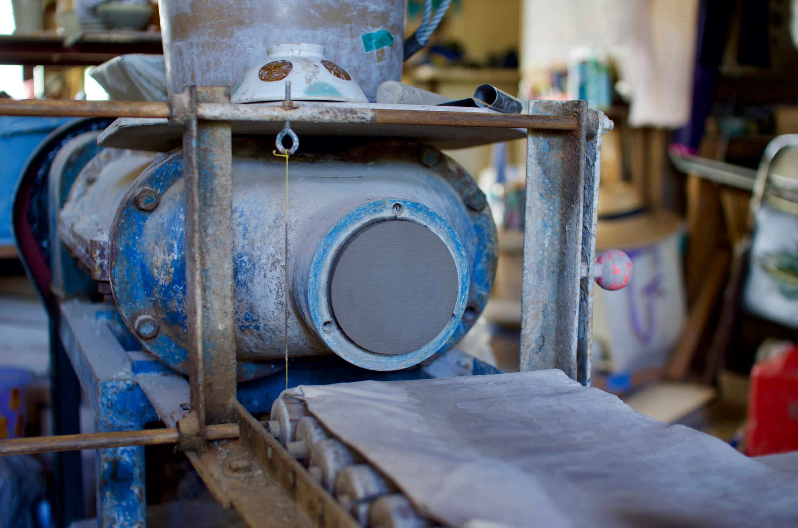 Kneading clay with a machine